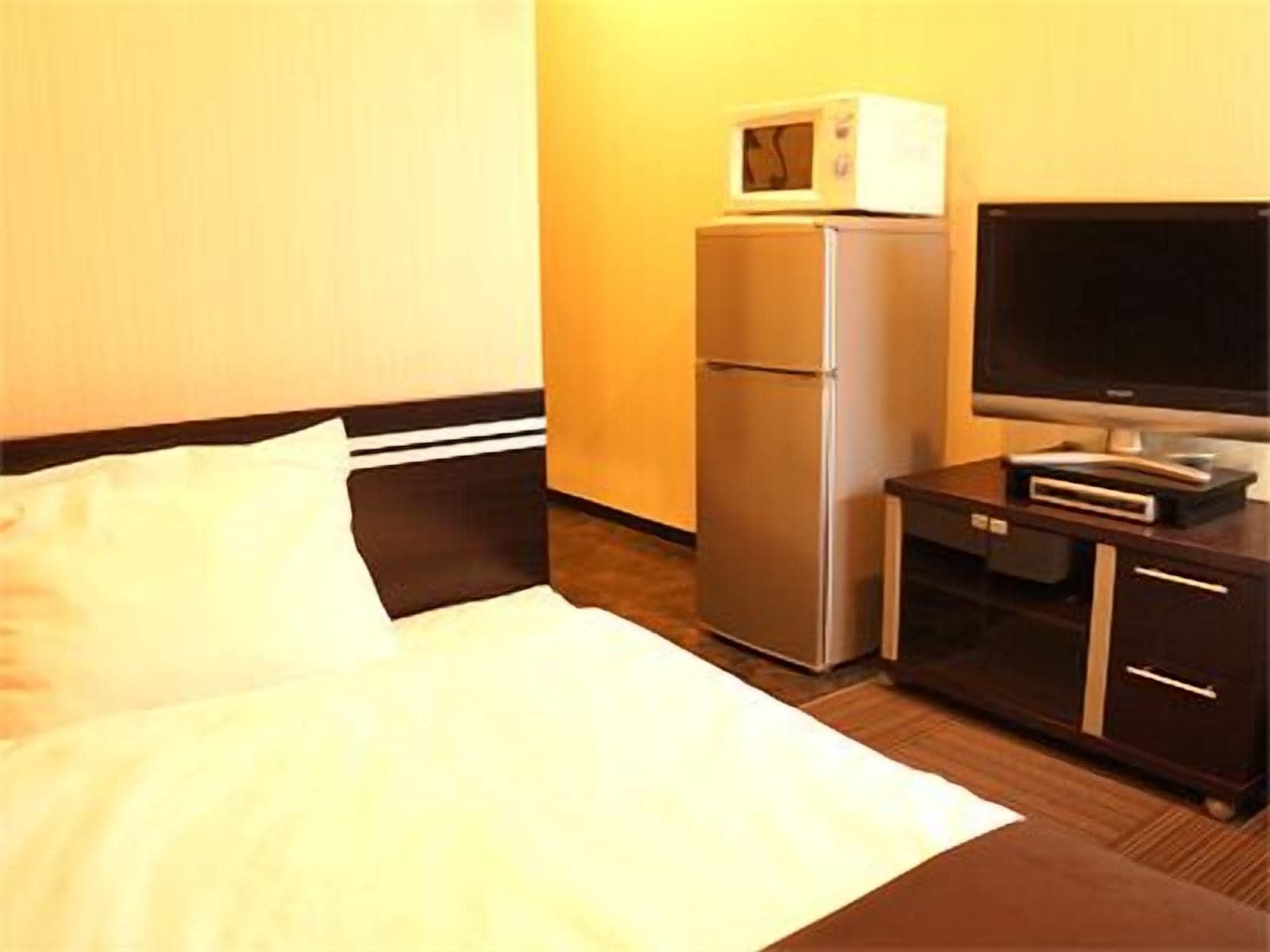 Hotel Livemax Budget Esaka Суйта Екстер'єр фото